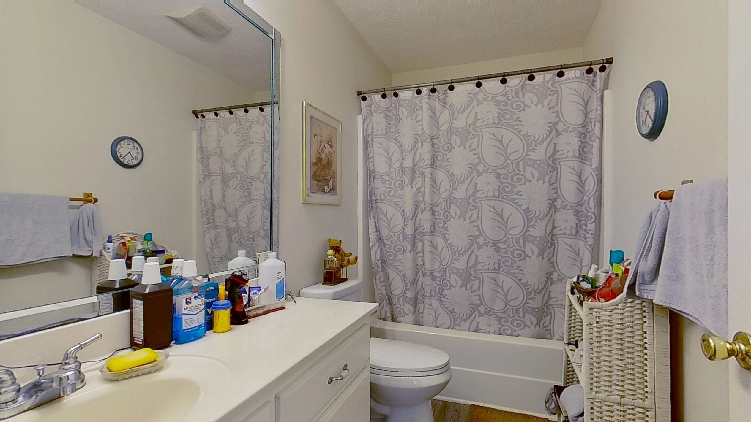 30 Rodeo Way Savannah, TN 38372 - Photo 14 of 29 Bathroom featuring shower / bath combo with shower curtain and vanity