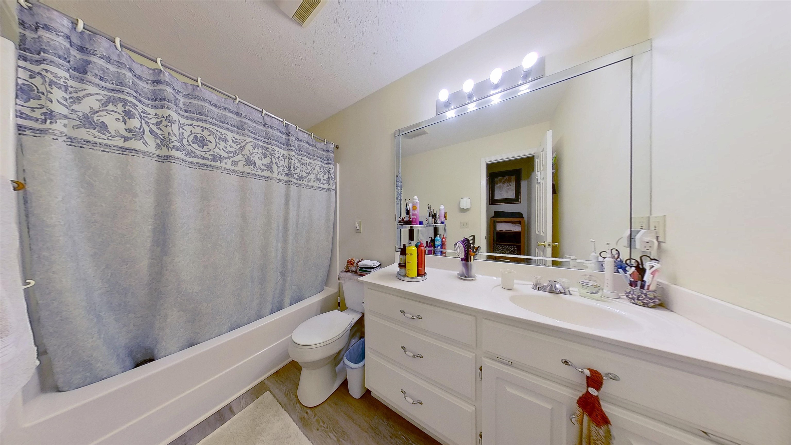 30 Rodeo Way Savannah, TN 38372 - Photo 9 of 29 Full bath with shower / bath combo with shower curtain, vanity, and light wood finished floors