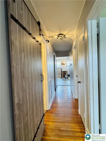 a view of gallery with wooden floor