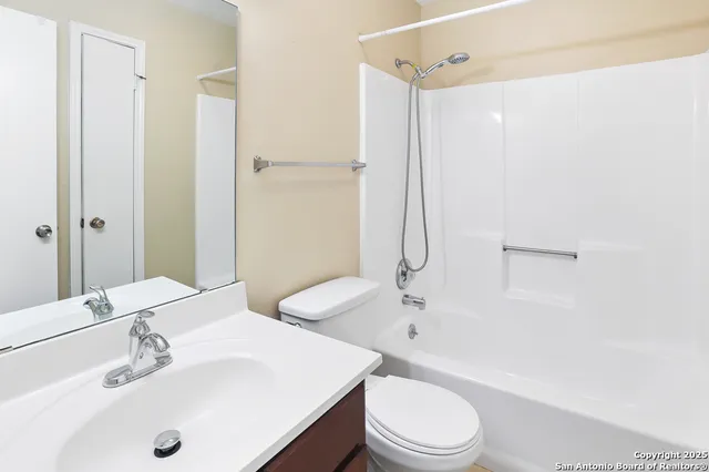 a view of a house with a big yard potted plants