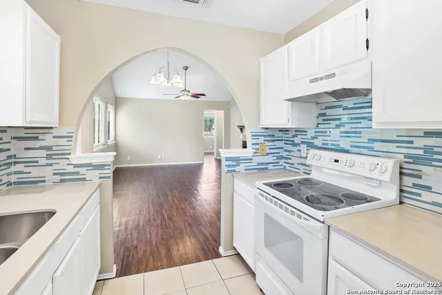a kitchen with a sink and a window