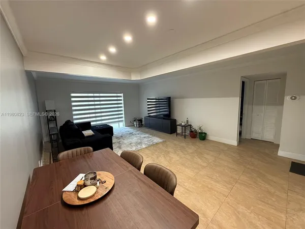 a kitchen with a table and chairs in it