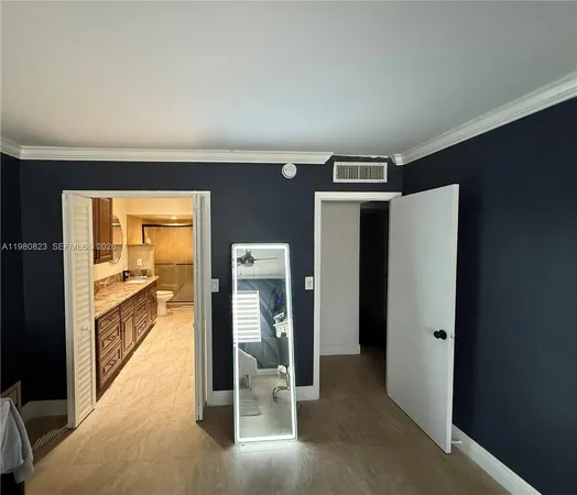 a view of a hallway with wooden shelves