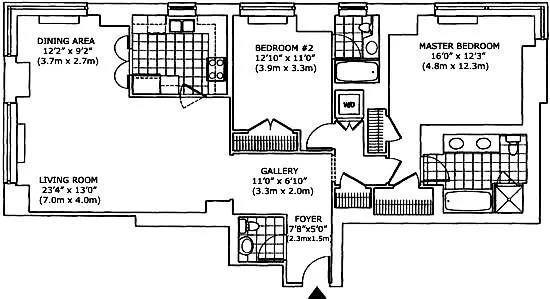 a bedroom with a bed and a lamp