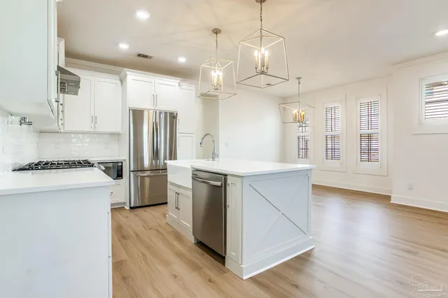 a bathroom with a double vanity sink toilet and shower