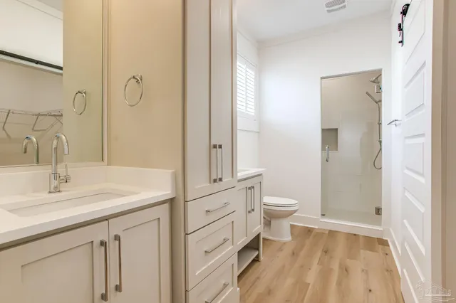 a view of a balcony with chairs and wooden floor