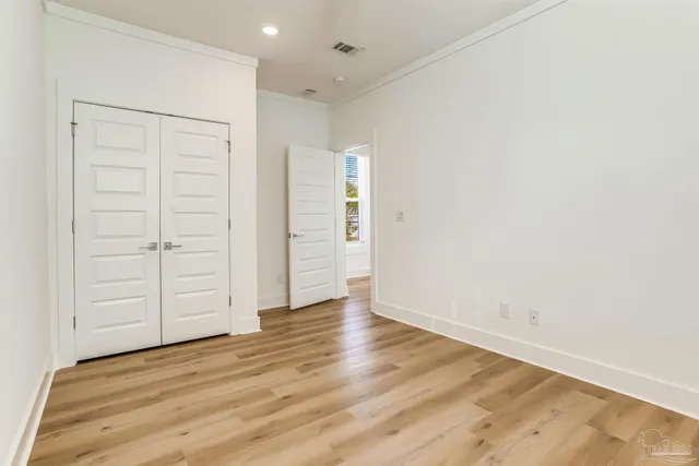 a view of an empty room with a garage