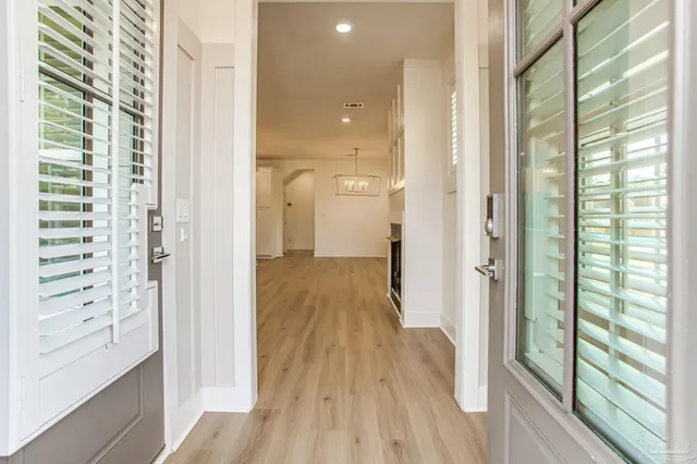 a view of kitchen with cabinets and wooden floor