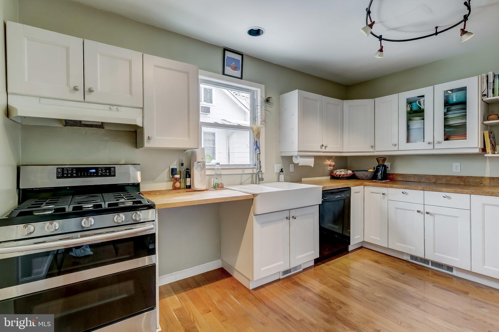 2416 Steele Road Baltimore, MD 21209 - Photo 11 of 47 a kitchen with stainless steel appliances granite countertop a stove and cabinets