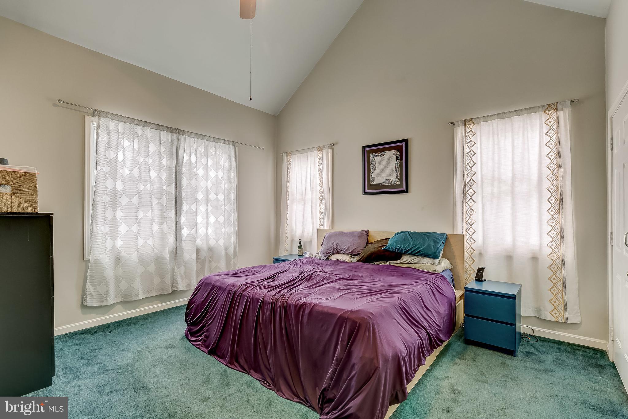 2416 Steele Road Baltimore, MD 21209 - Photo 20 of 47 a bed sitting in a spacious bedroom next to a window