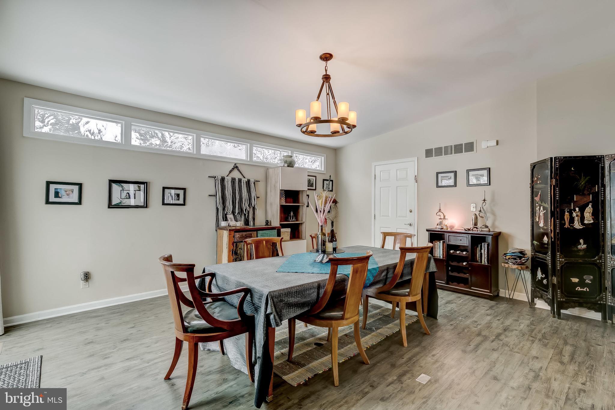 2416 Steele Road Baltimore, MD 21209 - Photo 3 of 47 a view of a dining room with furniture and chandelier