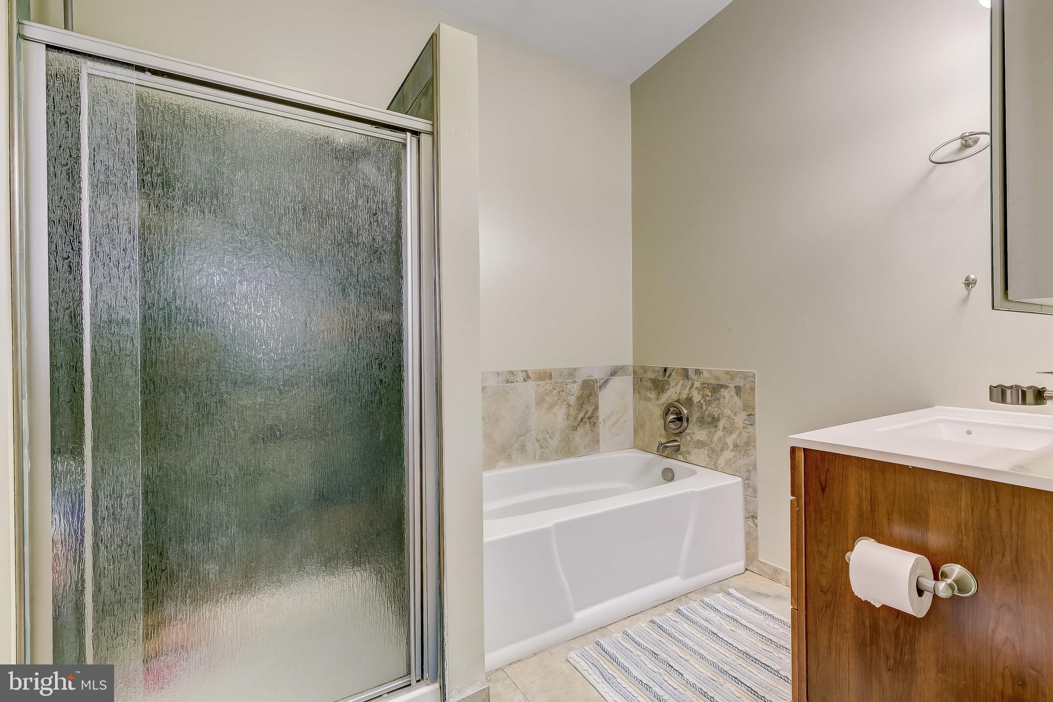 2416 Steele Road Baltimore, MD 21209 - Photo 22 of 47 a bathroom with a tub and shower