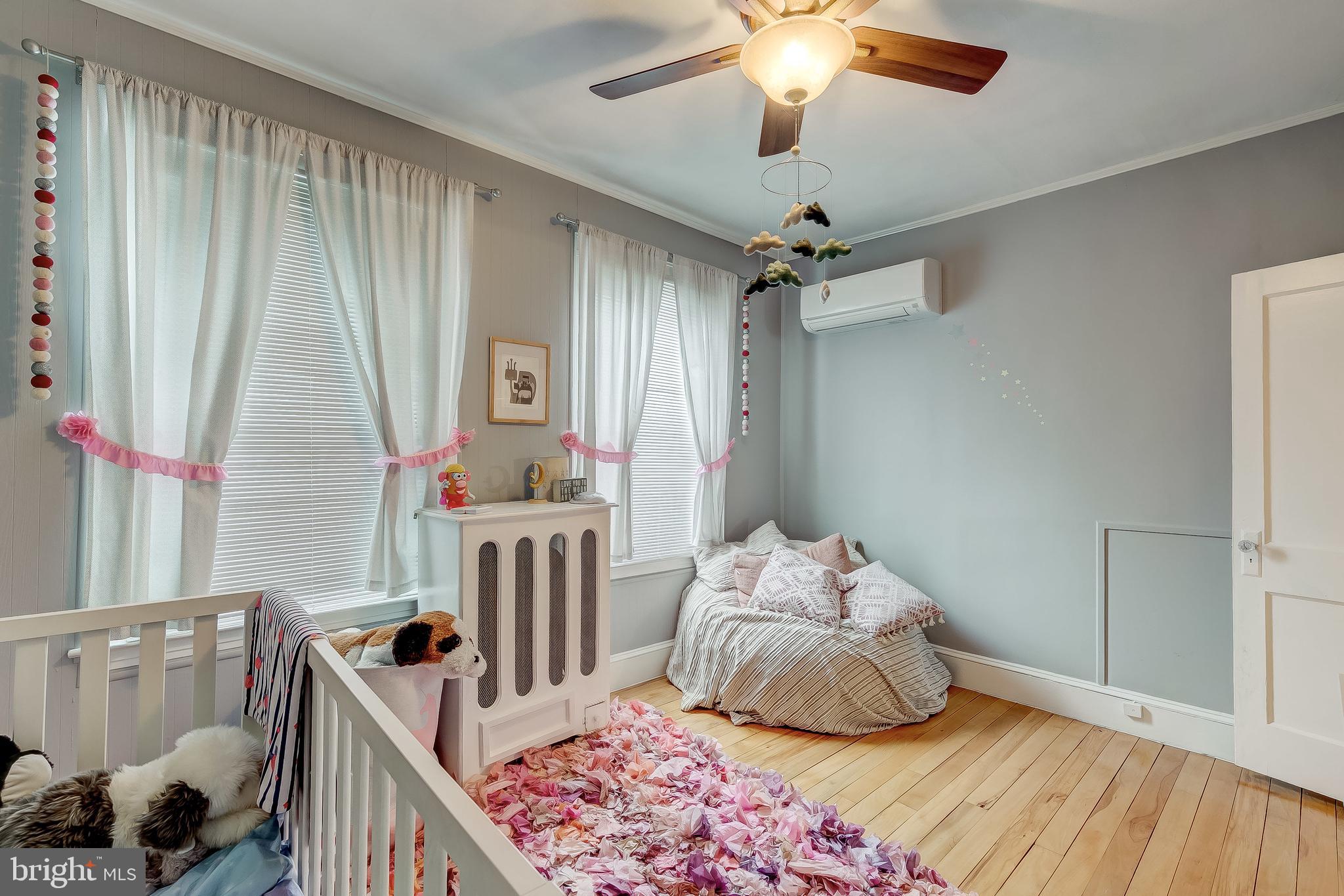 2416 Steele Road Baltimore, MD 21209 - Photo 28 of 47 a bedroom with furniture and a window