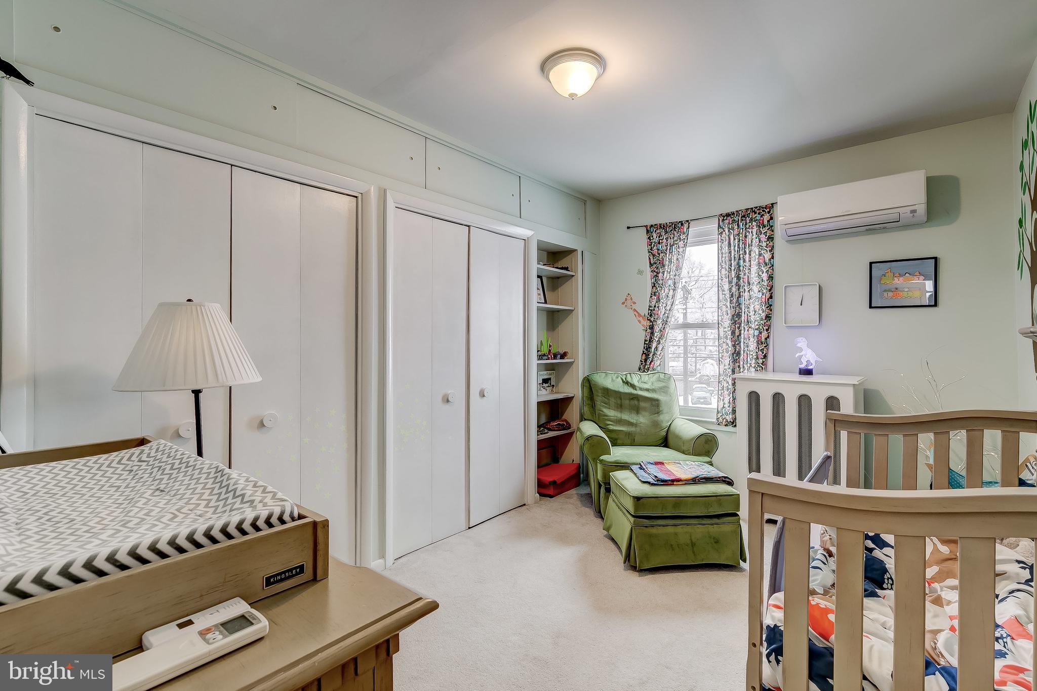 2416 Steele Road Baltimore, MD 21209 - Photo 29 of 47 a living room with furniture and a baby crib
