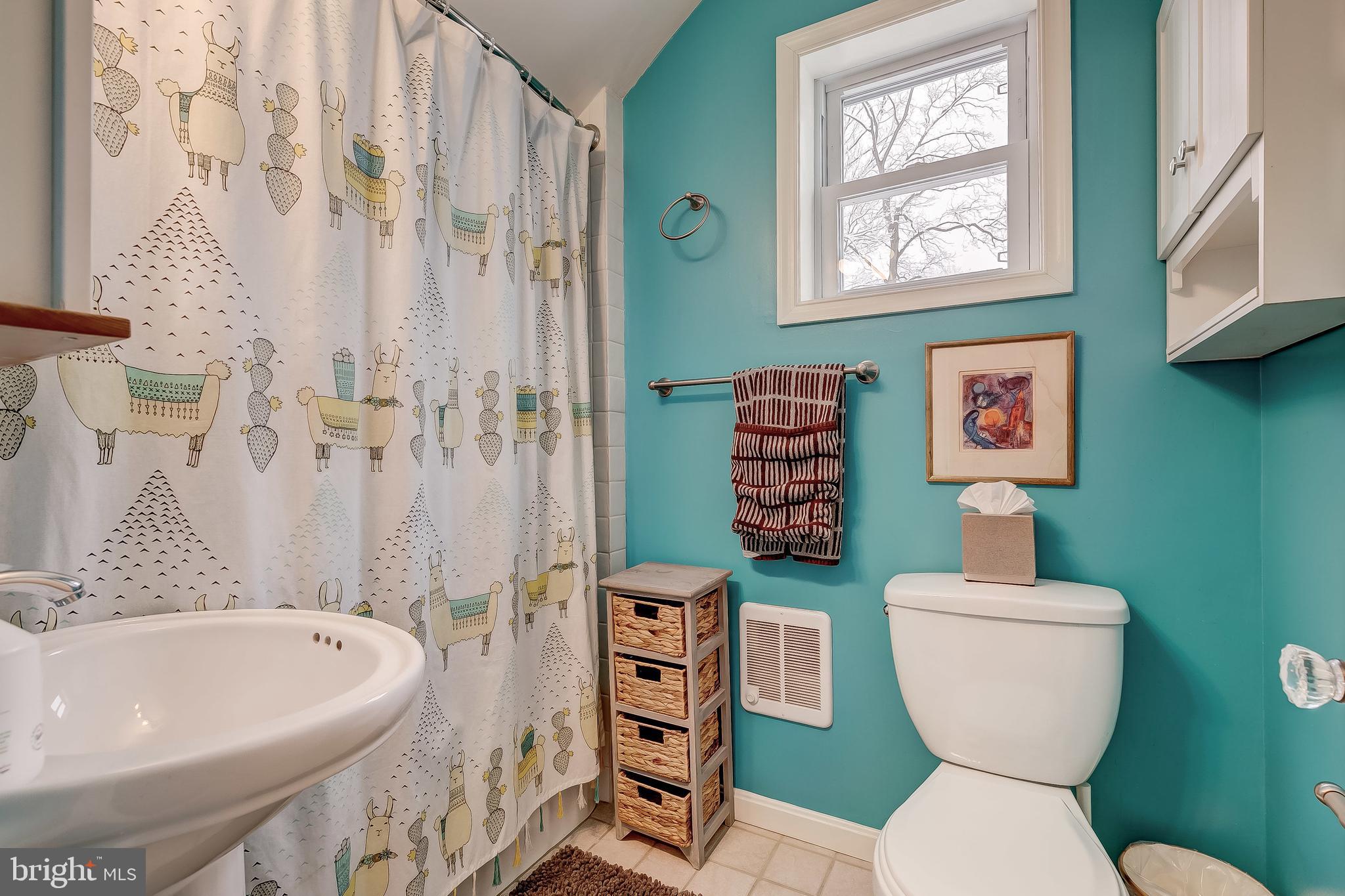 2416 Steele Road Baltimore, MD 21209 - Photo 32 of 47 a bathroom with a toilet sink and mirror