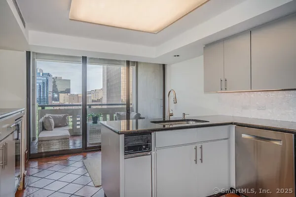 a kitchen with a sink and cabinets