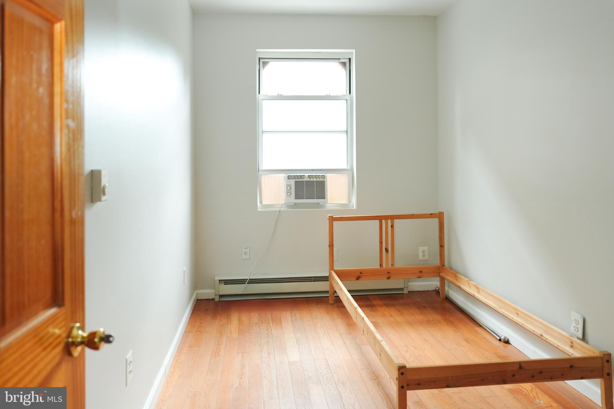 222 South 43rd Street, Unit 3 Philadelphia, PA 19104 - Photo 13 of 14 an empty room with a window