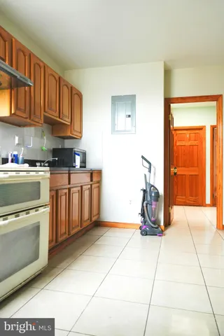a kitchen with stainless steel appliances granite countertop a stove a sink and a cabinets