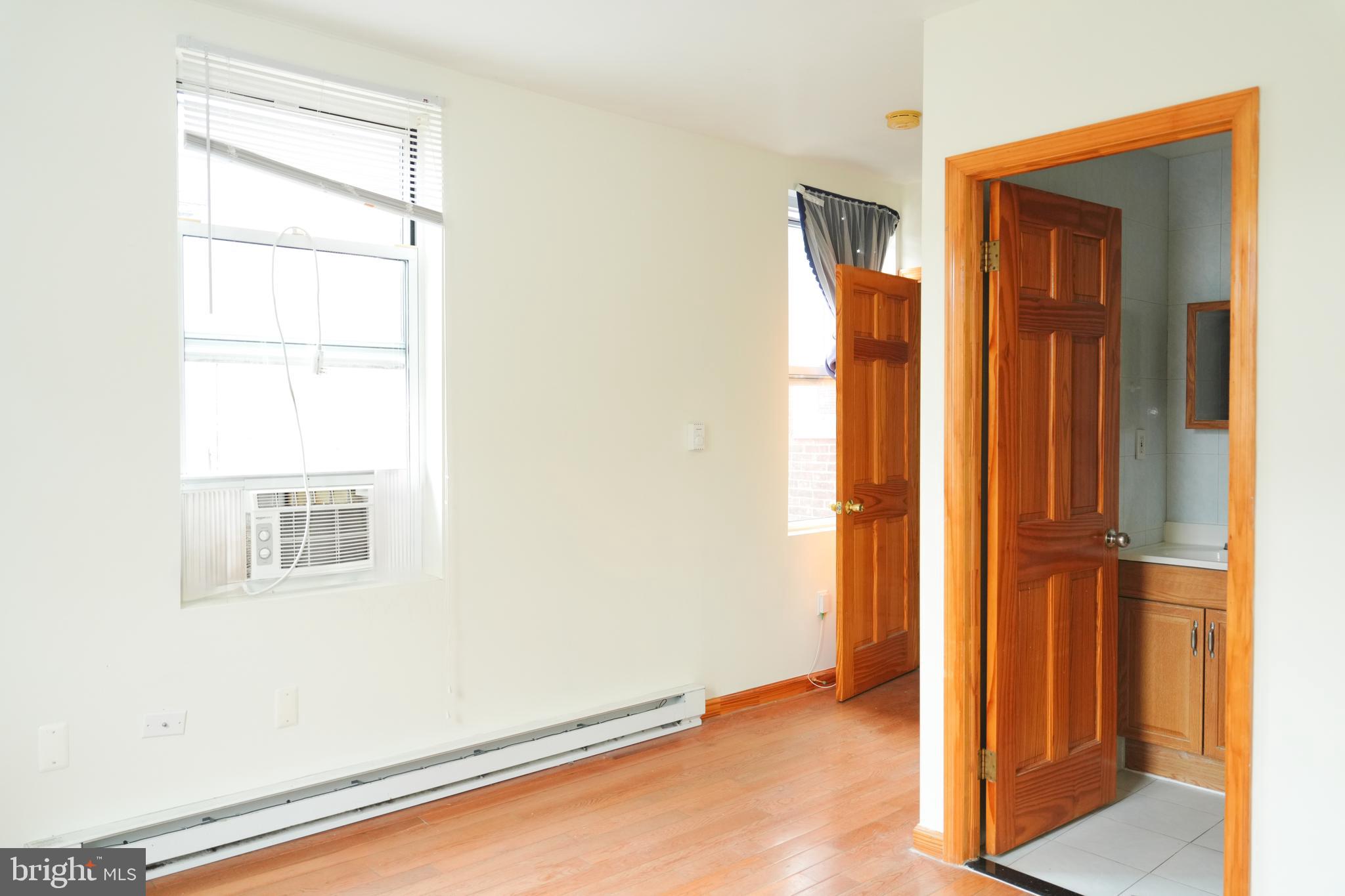 222 South 43rd Street, Unit 3 Philadelphia, PA 19104 - Photo 9 of 14 a view of an empty room with closet and a window
