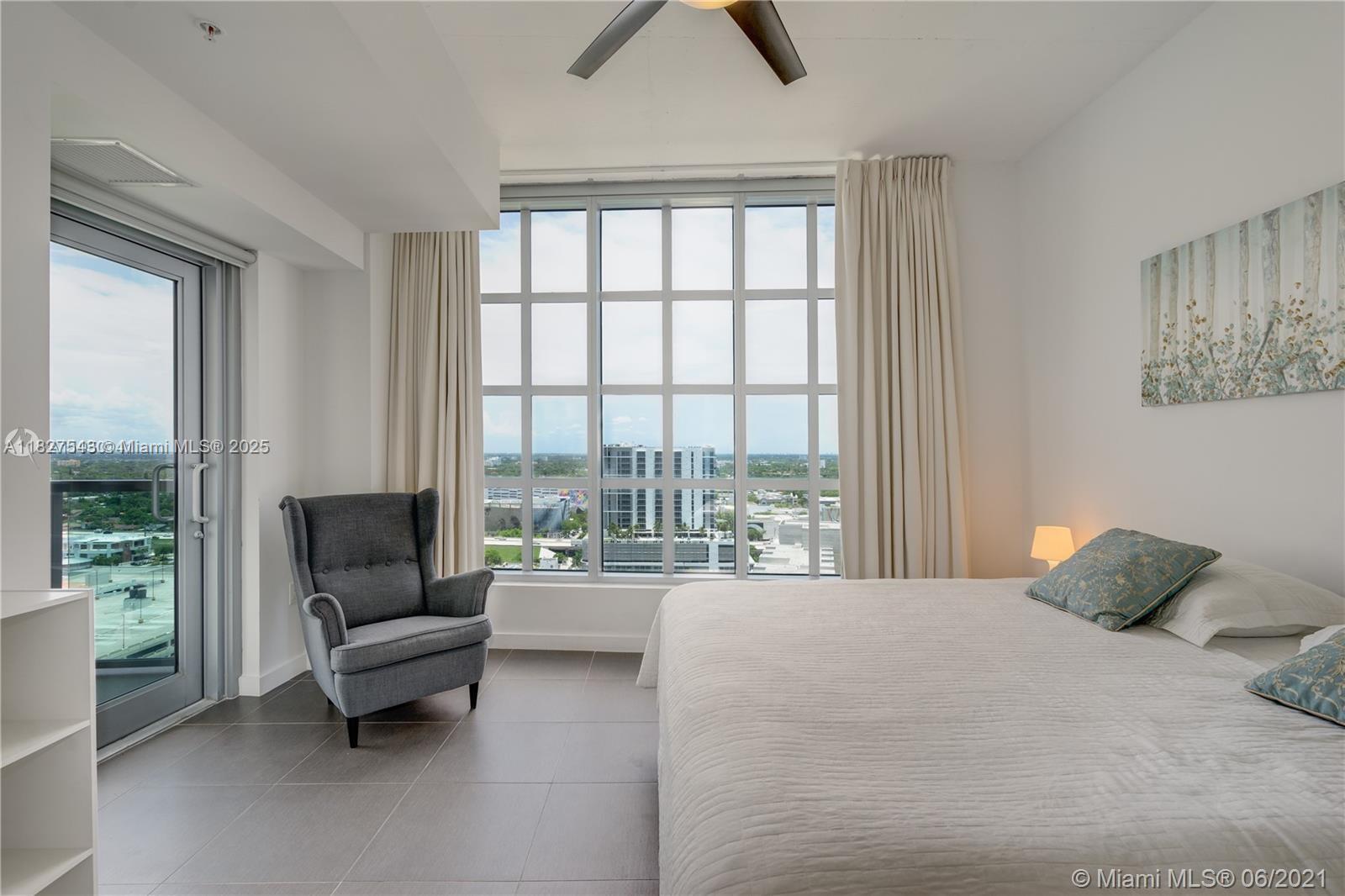 3301 Northeast 1st Avenue, Unit H2009 Miami, FL 33137 - Photo 16 of 45 a bedroom with furniture and a large window