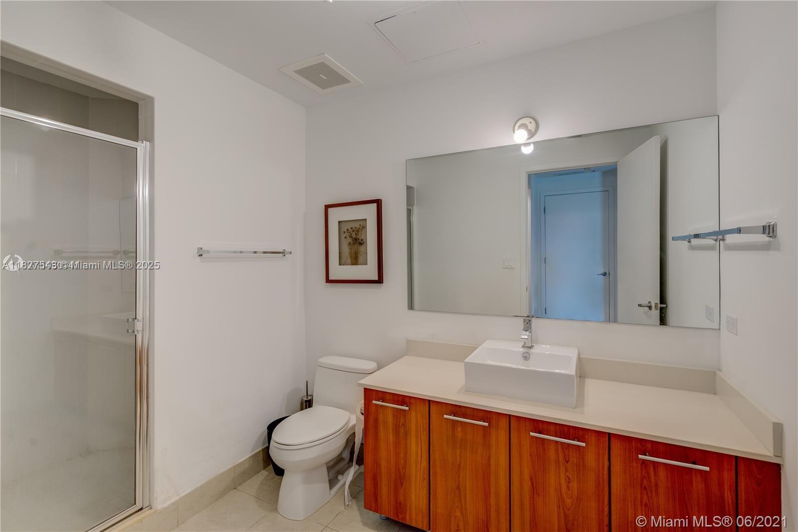 3301 Northeast 1st Avenue, Unit H2009 Miami, FL 33137 - Photo 20 of 45 a bathroom with a sink a toilet and shower