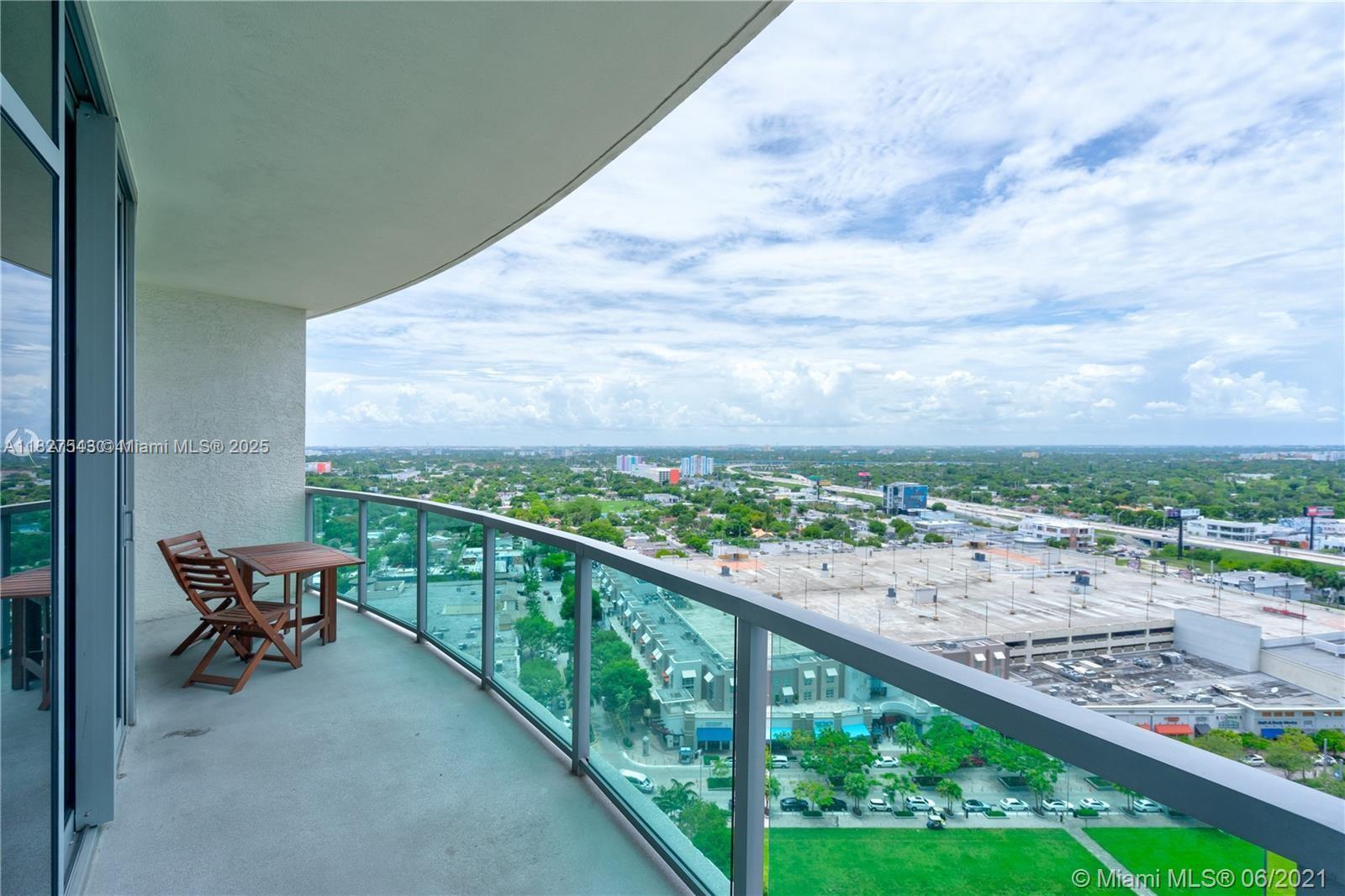 3301 Northeast 1st Avenue, Unit H2009 Miami, FL 33137 - Photo 2 of 45 a city view from a balcony with outdoor seating