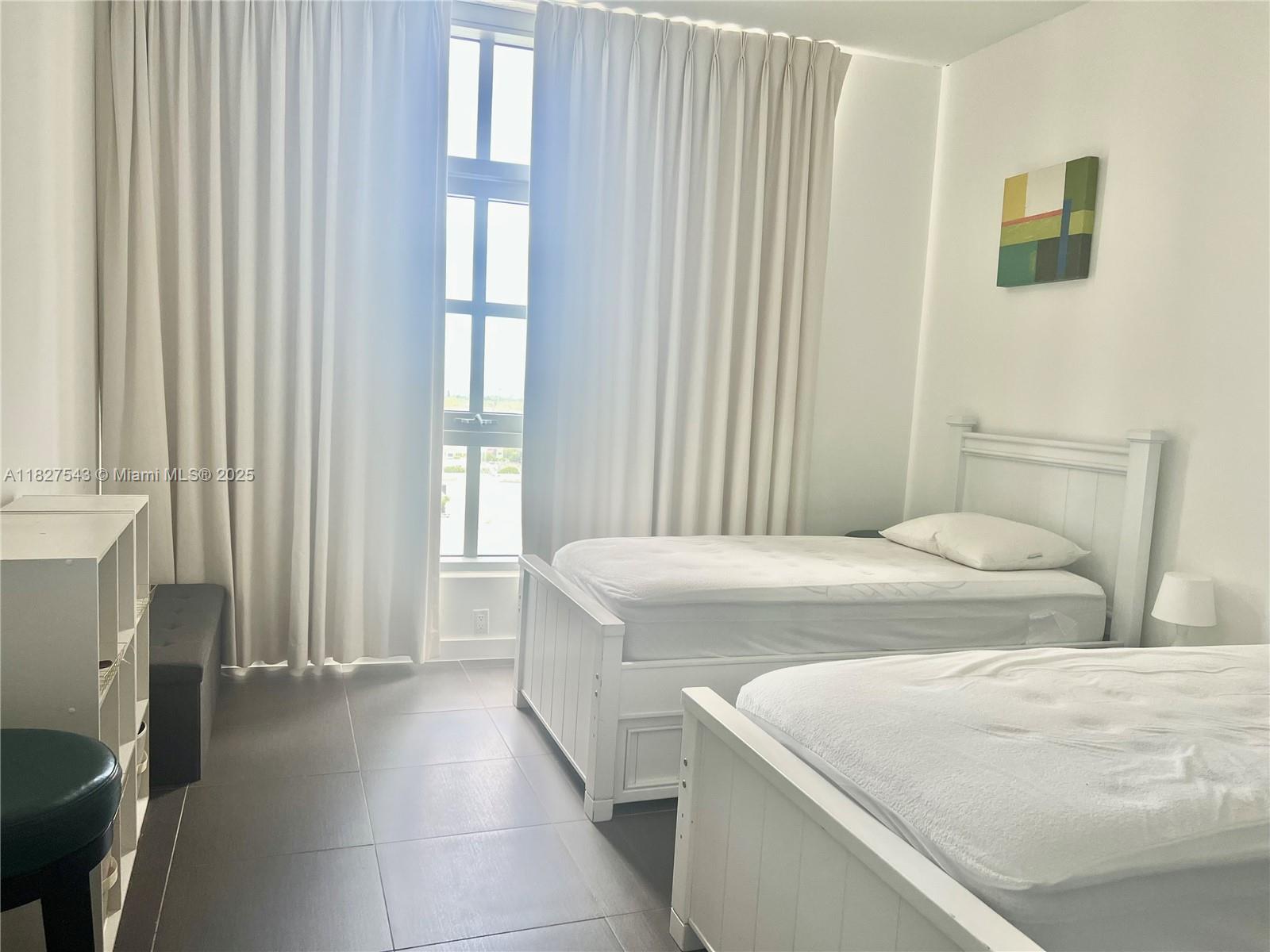 3301 Northeast 1st Avenue, Unit H2009 Miami, FL 33137 - Photo 24 of 45 a bedroom with a bed and a window