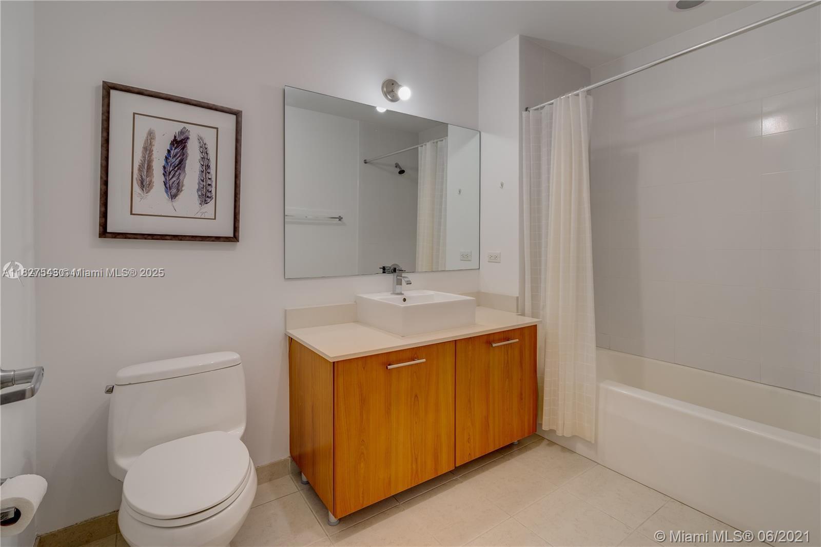 3301 Northeast 1st Avenue, Unit H2009 Miami, FL 33137 - Photo 27 of 45 a bathroom with a granite countertop sink toilet and a bathtub