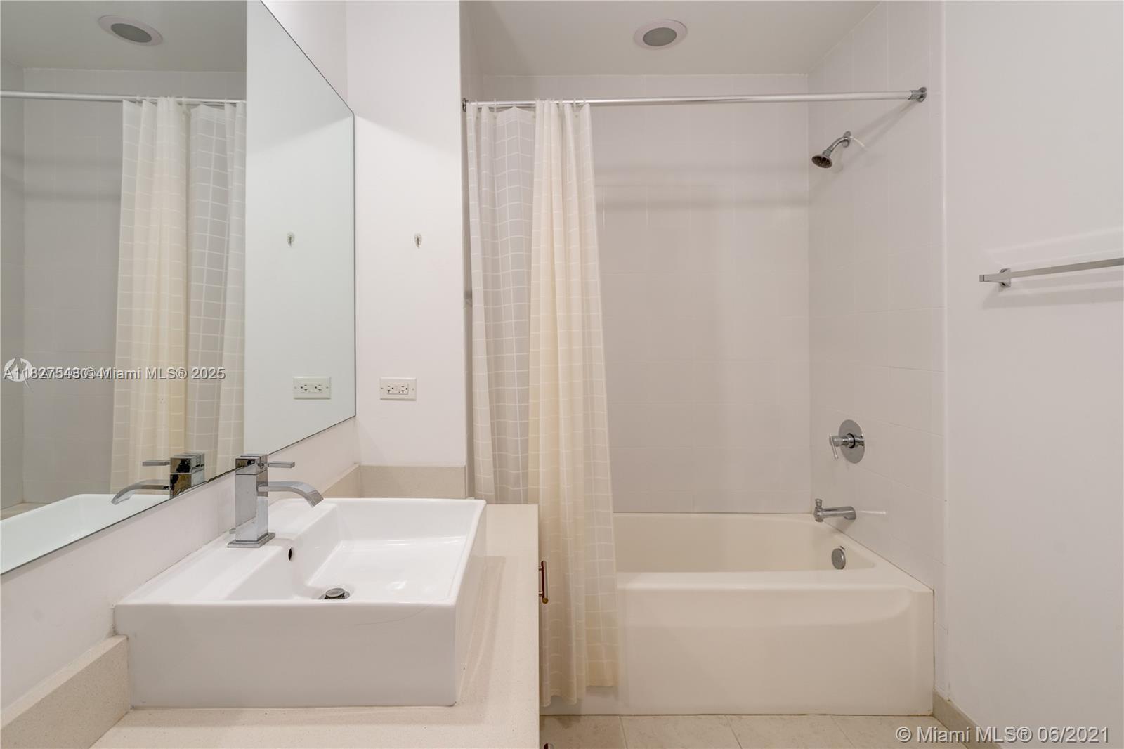 3301 Northeast 1st Avenue, Unit H2009 Miami, FL 33137 - Photo 28 of 45 a bathroom with a bathtub and a sink