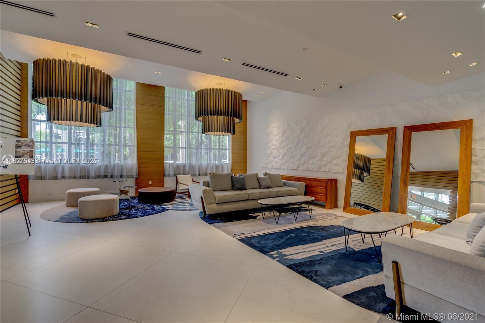 3301 Northeast 1st Avenue, Unit H2009 Miami, FL 33137 - Photo 32 of 45 a living room with furniture and a large window