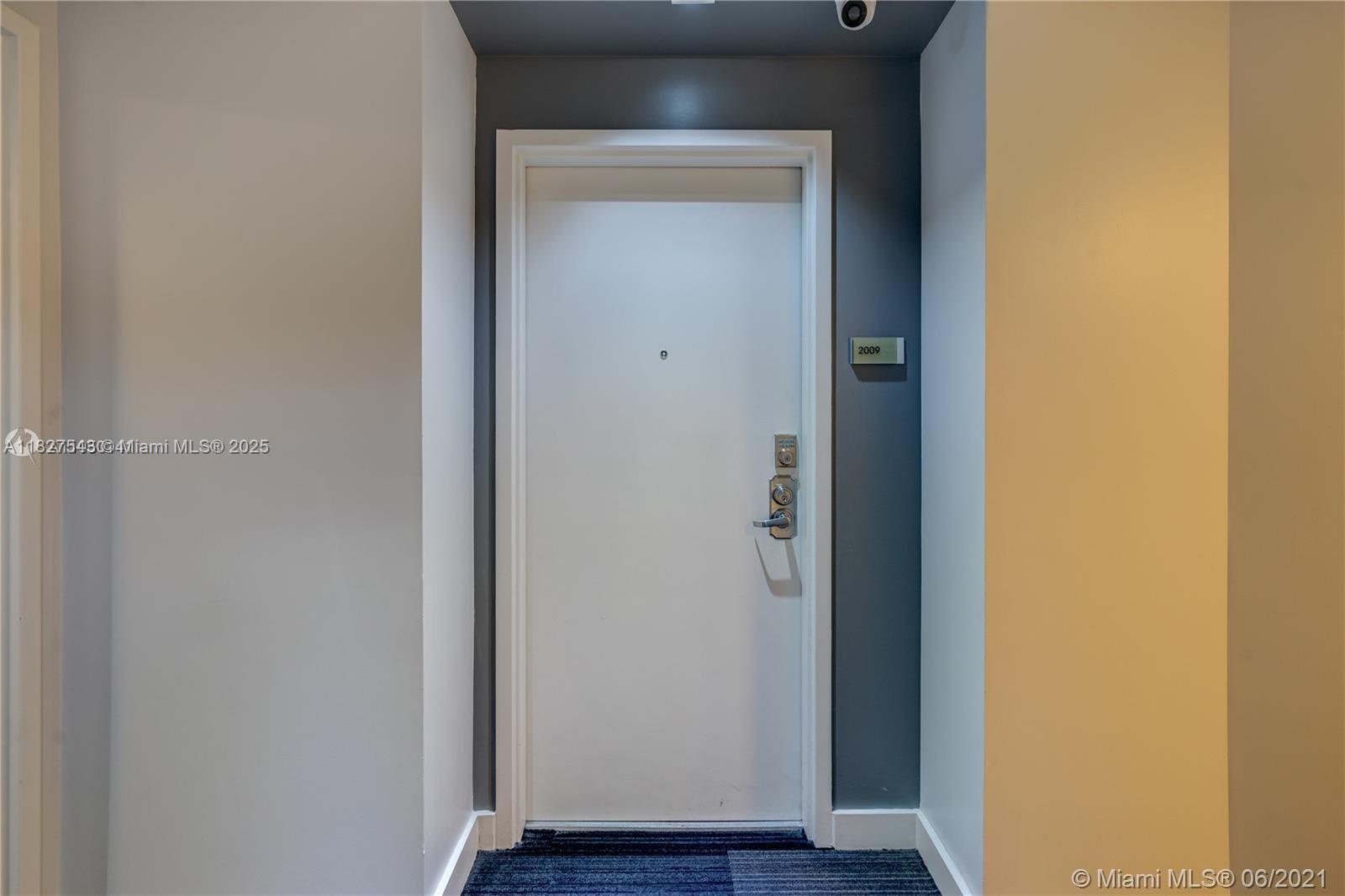 3301 Northeast 1st Avenue, Unit H2009 Miami, FL 33137 - Photo 44 of 45 a view of front door with wooden floor
