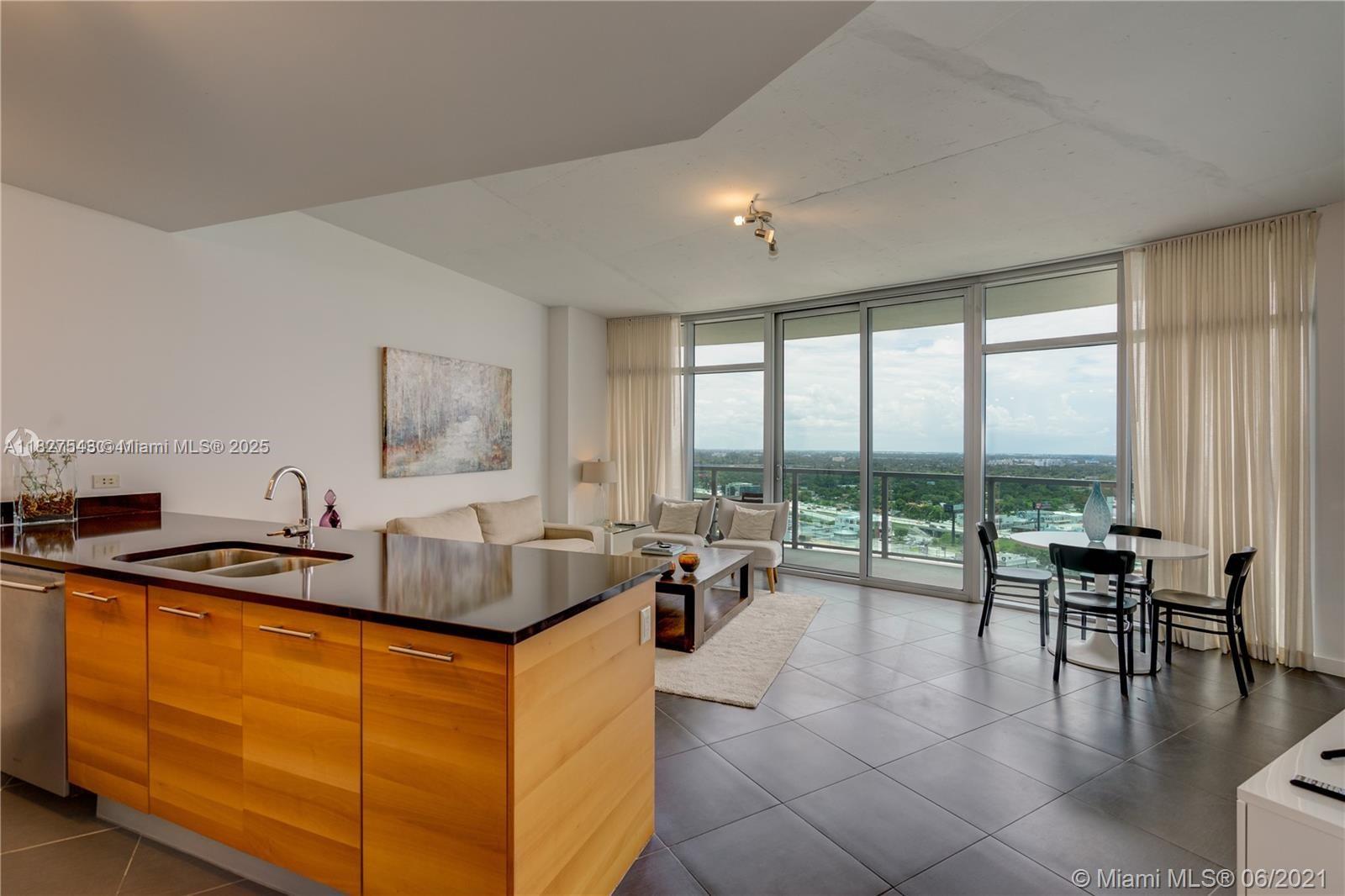 3301 Northeast 1st Avenue, Unit H2009 Miami, FL 33137 - Photo 5 of 45 a living room with furniture and large windows