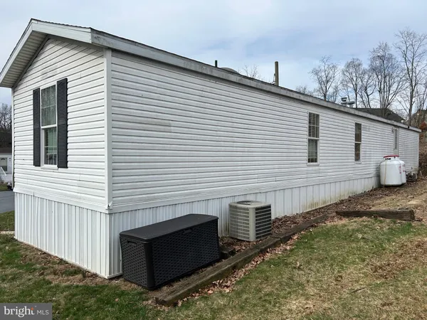 a view of a white house with many windows