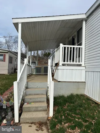 a view of a house with wooden stairs