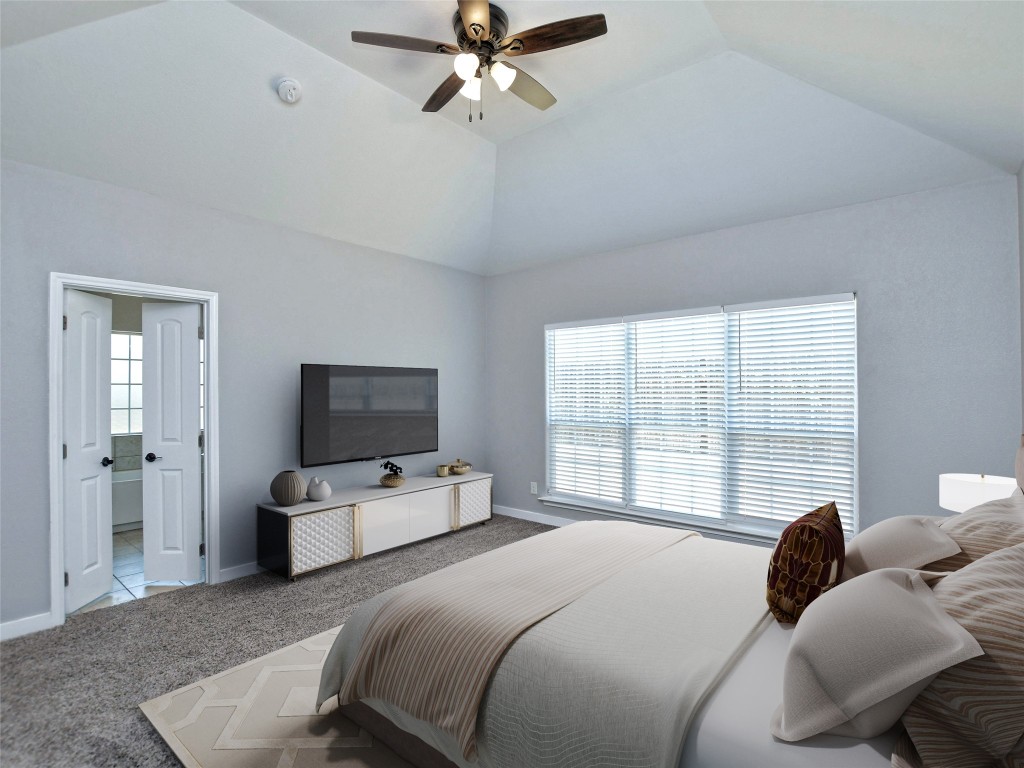 217 Geode Lane Jarrell, TX 76537 - Photo 19 of 35 Bedroom featuring carpet flooring, vaulted ceiling, and a ceiling fan