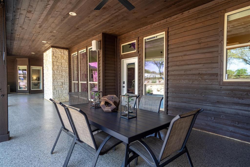 2431 Dr Sanders Road Cross Roads, TX 76227 - Photo 26 of 40 a view of a dining room with furniture and window