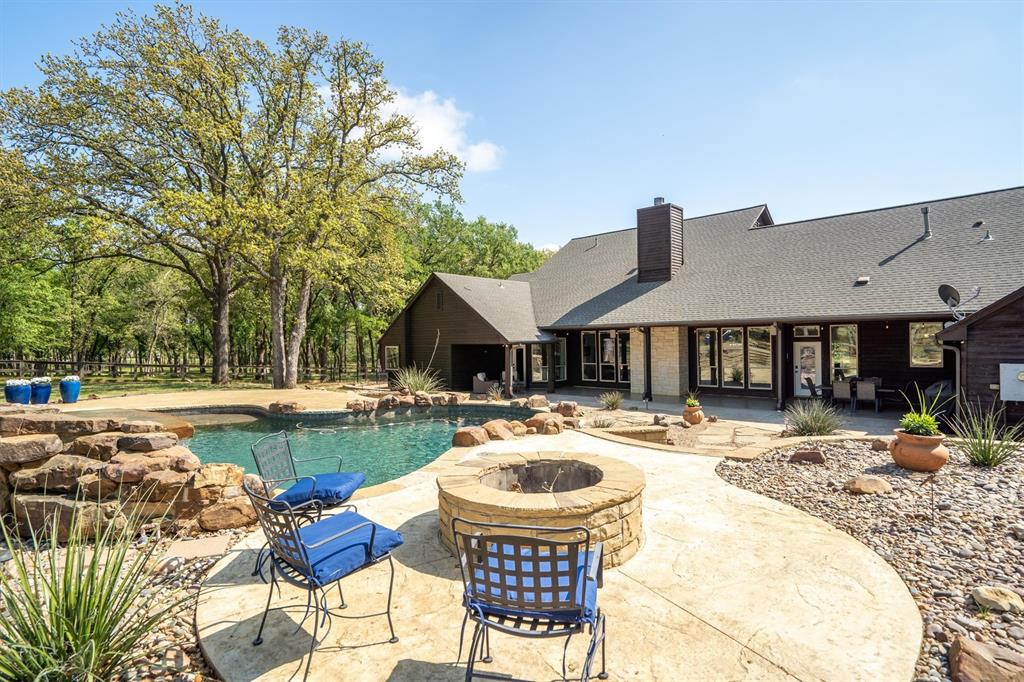 2431 Dr Sanders Road Cross Roads, TX 76227 - Photo 30 of 40 a view of a house with swimming pool and furniture