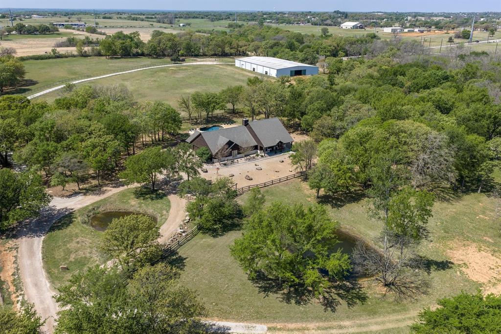 2431 Dr Sanders Road Cross Roads, TX 76227 - Photo 3 of 40 an aerial view of residential houses with outdoor space and river