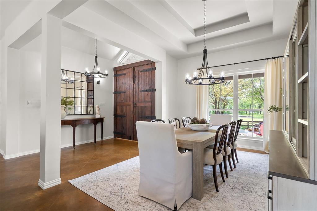 2431 Dr Sanders Road Cross Roads, TX 76227 - Photo 6 of 40 a dining room with furniture a chandelier and wooden floor