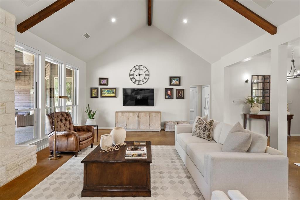 2431 Dr Sanders Road Cross Roads, TX 76227 - Photo 9 of 40 a living room with furniture a rug and a flat screen tv
