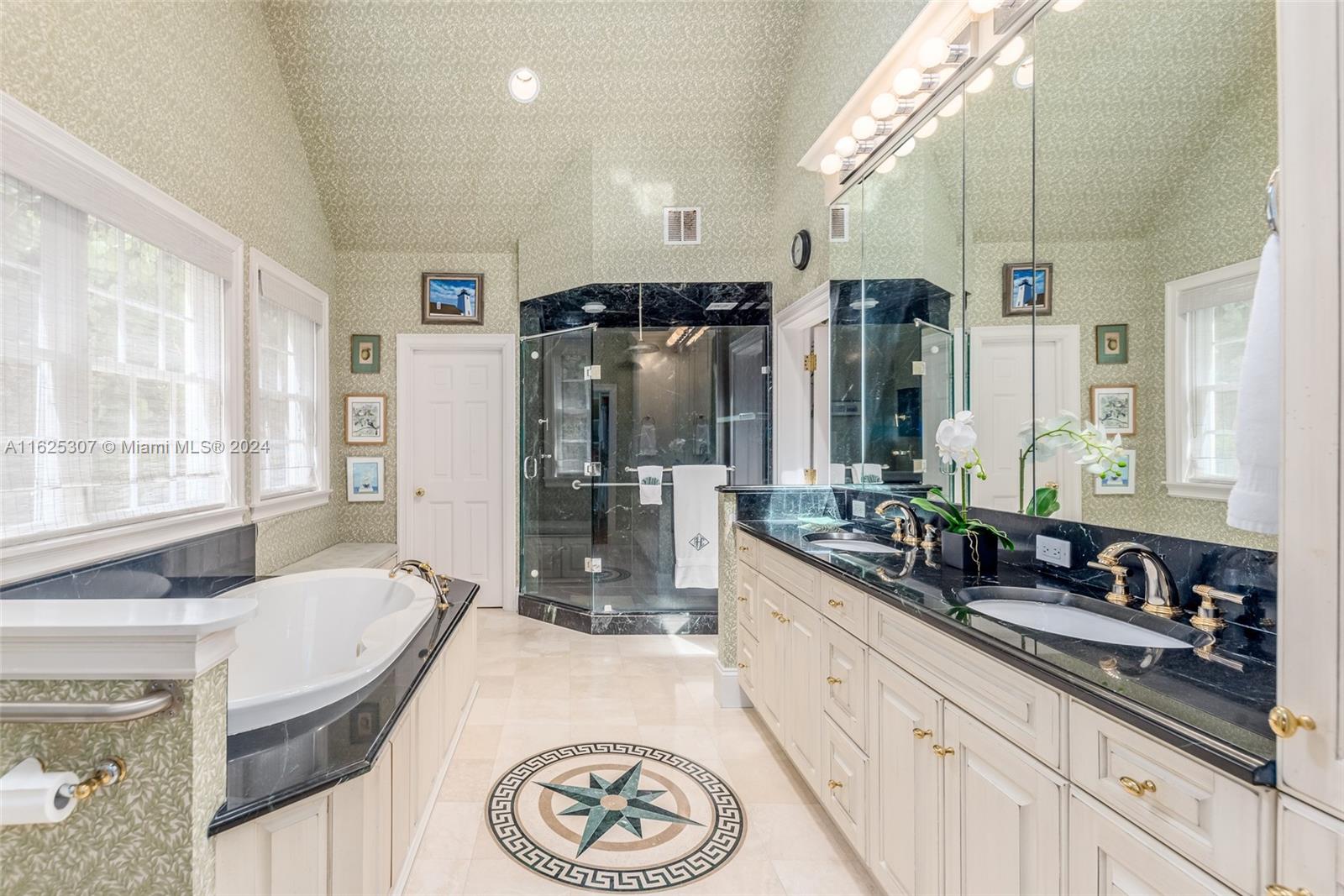 43 North Beach Road Jupiter Island, FL 33455 - Photo 13 of 34 a bathroom with a granite countertop sink and a large mirror