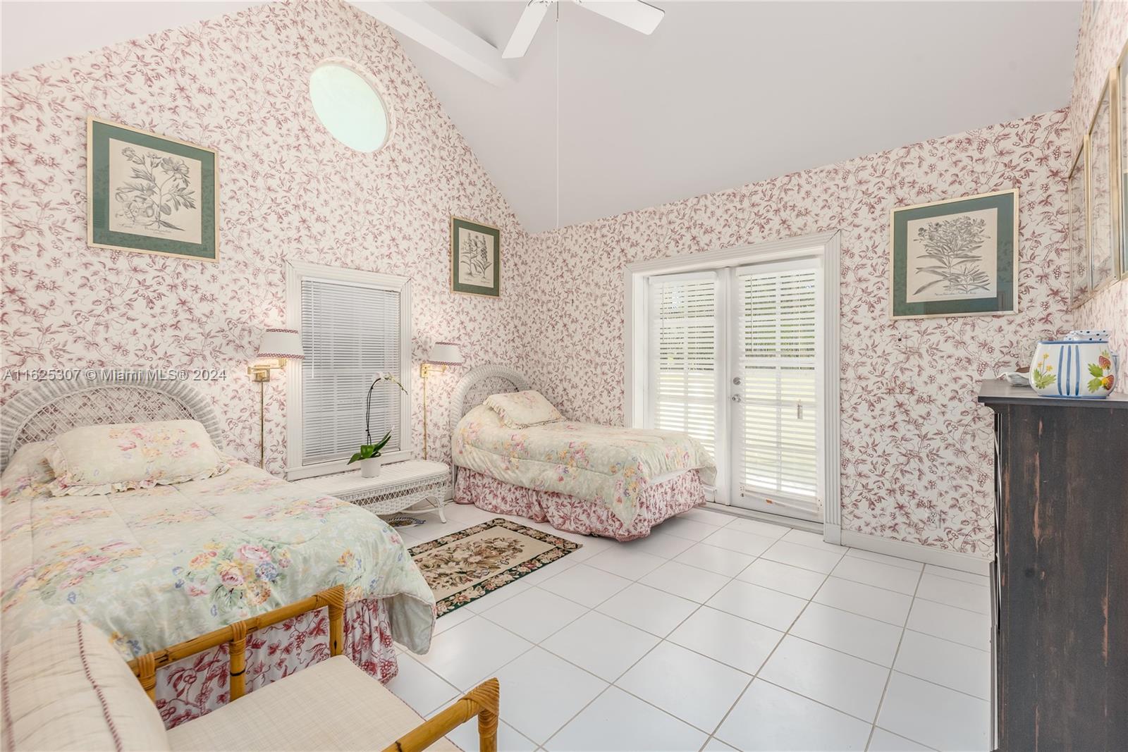 43 North Beach Road Jupiter Island, FL 33455 - Photo 23 of 34 a bedroom with a bed and a window