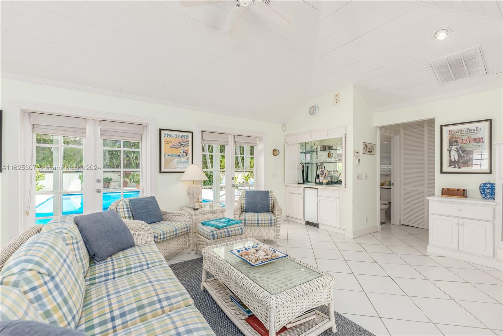 43 North Beach Road Jupiter Island, FL 33455 - Photo 26 of 34 a living room with furniture and a table