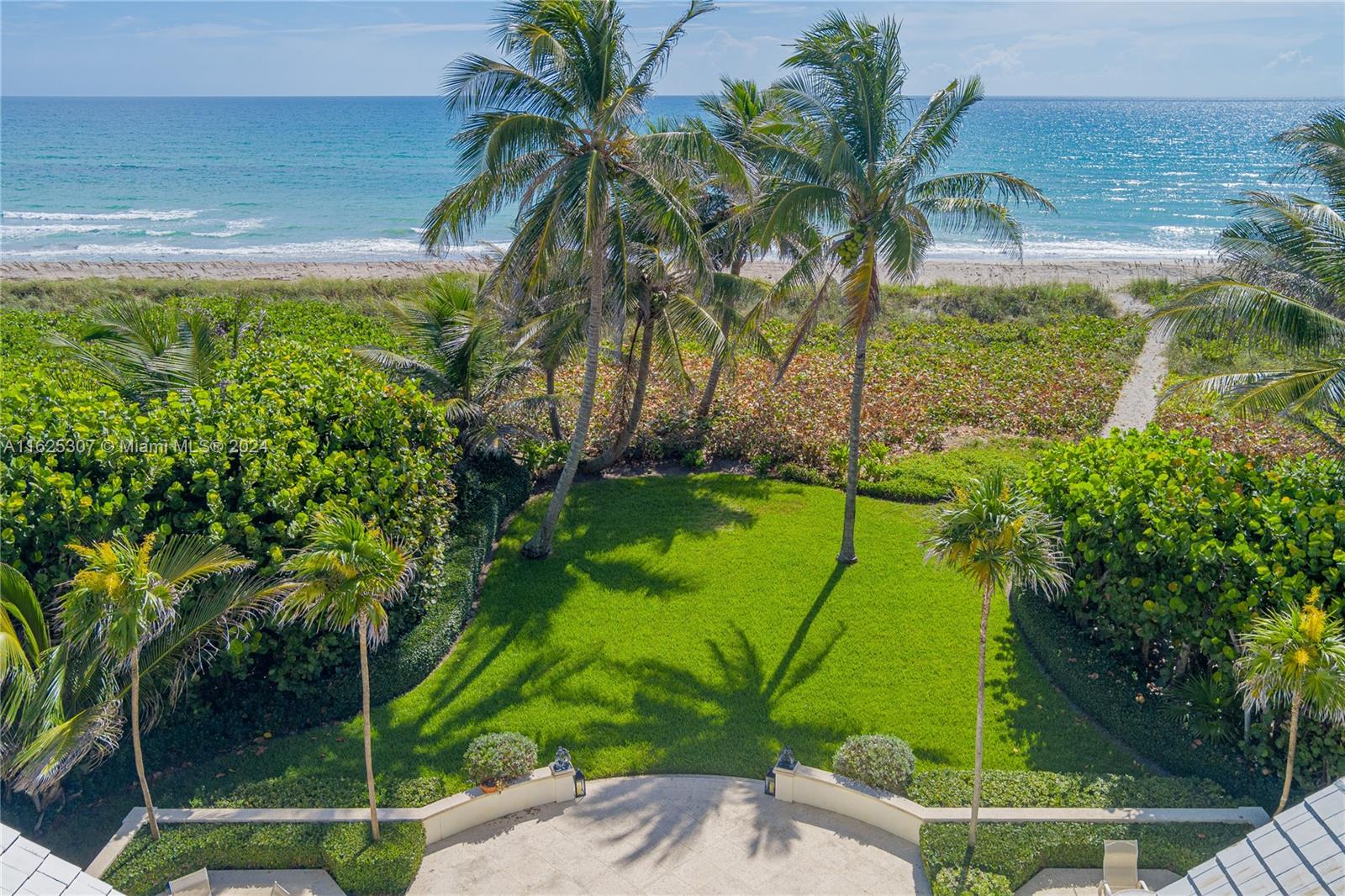 43 North Beach Road Jupiter Island, FL 33455 - Photo 30 of 34 a view of swimming pool from a garden