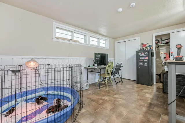 a bedroom with furniture and a window
