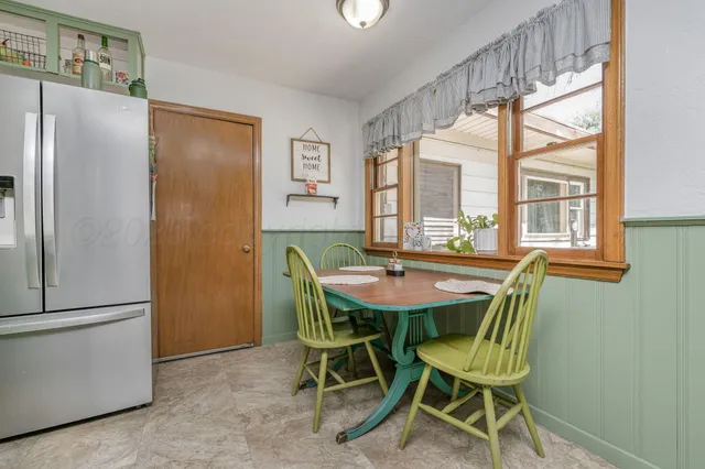 a view of a dining room with furniture window and outside view