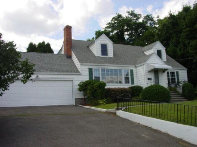 190 Davis Road Fairfield, CT 06825 - Photo 1 of 1 a front view of a house with a garden