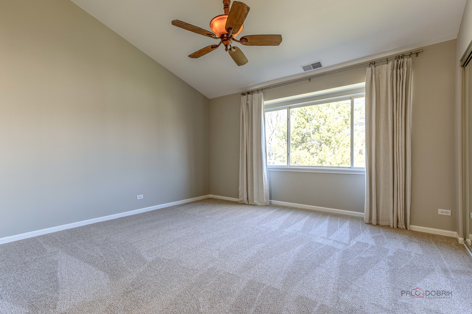 263 Camel Bend Court Schaumburg, IL 60107 - Photo 15 of 24 a view of room with a ceiling fan and window