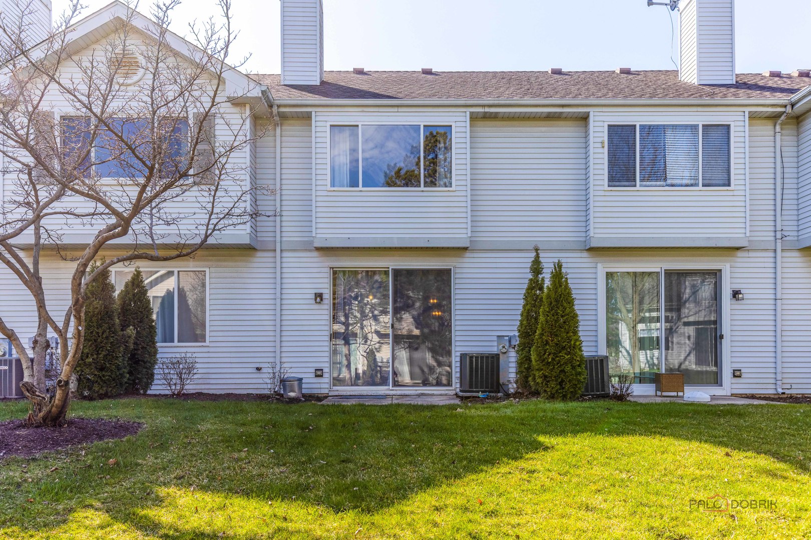 263 Camel Bend Court Schaumburg, IL 60107 - Photo 23 of 24 a front view of a house with a garden