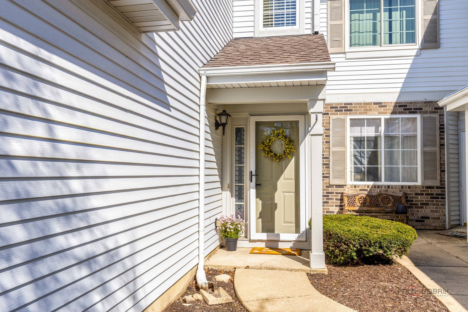 263 Camel Bend Court Schaumburg, IL 60107 - Photo 3 of 24 a front view of a house with a garden